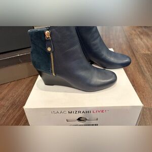 Brand new in box - dark navy blue leather. Brand:  Isaac Mizrahi